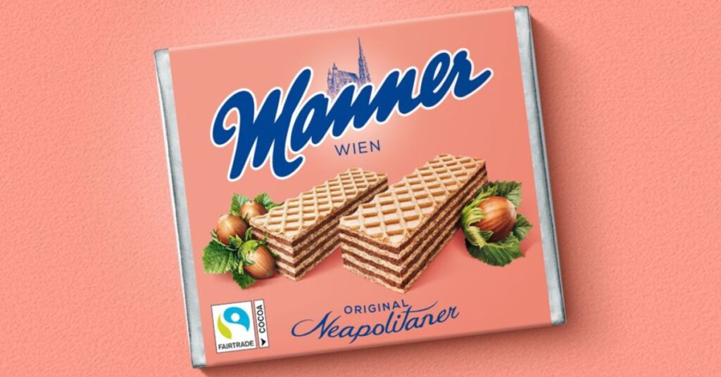 Manner Schnitten, Manner zmiany, Austria słodycze, redukcja cukru Manner, Dieter Messner, ceny kakao Europa, orzechy laskowe Turcja, wyniki finansowe Manner, produkcja Wiedeń, regulacje UE opakowania, austriackie słodycze zmiany, kryzys surowców spożywczych, marka Manner,